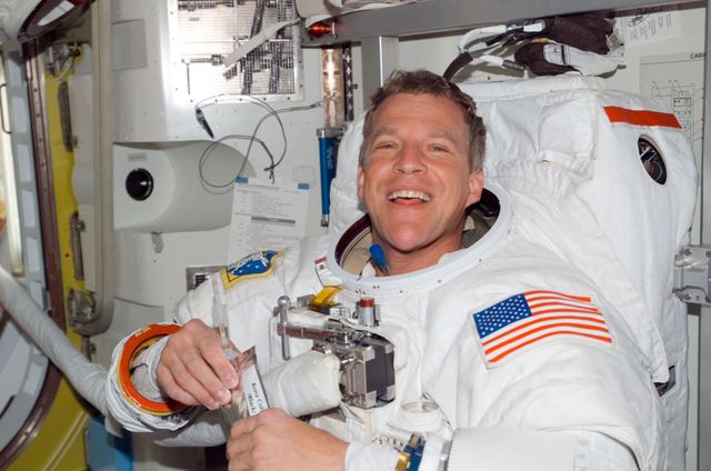 ISS016-E-006783 (26 Oct. 2007) --- Attired in his Extravehicular Mobility Unit (EMU) spacesuit, astronaut Scott Parazynski, STS-120 mission specialist, is pictured in the Quest Airlock of the International Space Station as the mission's first spacewalk draws to a close.