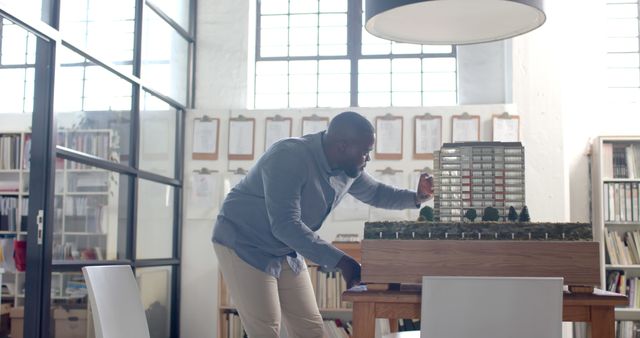 Architect Examining Building Model in Modern Office - Download Free Stock Images Pikwizard.com