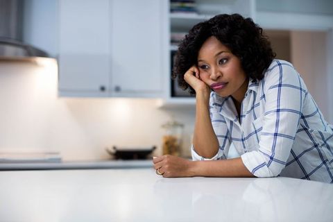 Pensive Woman Standing in Modern Kitchen Interior - Download Free Stock Images Pikwizard.com