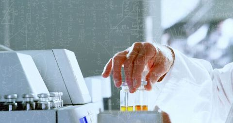 Scientist adjusting equipment in modern laboratory setting