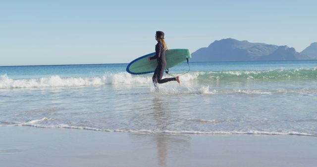 Surfer Running into the Ocean with a Surfboard - Download Free Stock Images Pikwizard.com