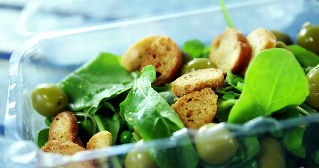 Healthy Spinach Salad with Olives and Croutons in Plastic Container - Download Free Stock Images Pikwizard.com