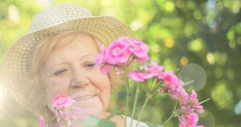 Senior Woman Enjoying Blooming Garden with Peaceful Expression - Download Free Stock Images Pikwizard.com