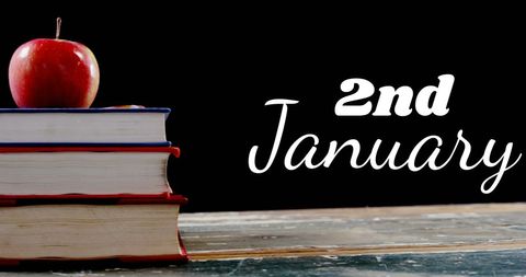 Education Concept with Books and Apple on 2nd January - Download Free Stock Images Pikwizard.com