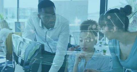 Diverse scientists analyzing digital data in modern office
