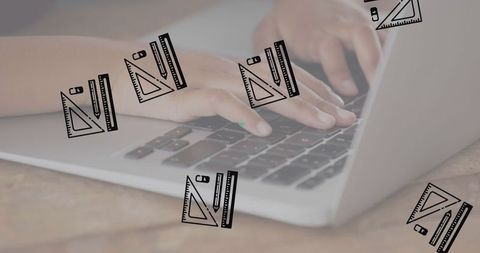 Hands typing on laptop keyboard for online learning and education