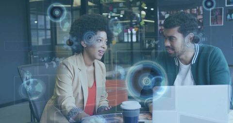 Business Professionals Discussing With Futuristic Digital Overlay