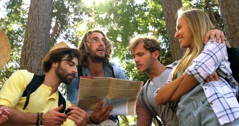 Group of Young Adults Navigating with Map in Forest Adventure - Download Free Stock Images Pikwizard.com