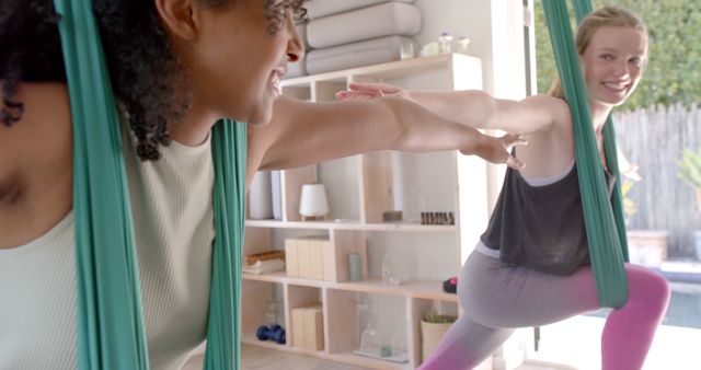 Women Practicing Aerial Yoga with Hammocks in Sunlit Studio - Download Free Stock Images Pikwizard.com