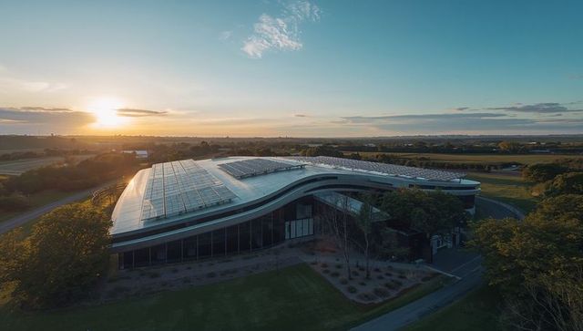 Modern Eco Building Featuring Solar Panels at Sunset