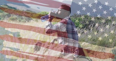 American Flag Overlay on Man Drinking Water in Mountains