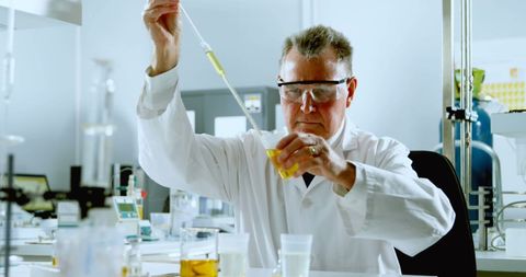 Caucasian Scientist Conducting Experiment in Modern Laboratory - Download Free Stock Images Pikwizard.com