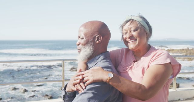 Happy Senior Couple Embracing By The Sea - Download Free Stock Images Pikwizard.com