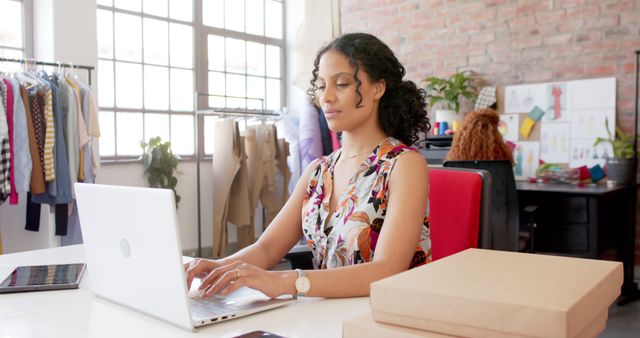 Fashion Designer Using Laptop in Modern Studio Workspace - Download Free Stock Images Pikwizard.com