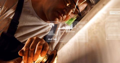 Machinist grinding metal with angle grinder sparks flying and ar data overlay hud
