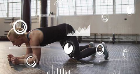 Woman holding modified plank with ar fitness overlays and performance tracking in gym