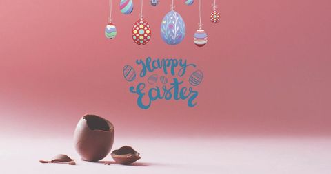 Colorful easter eggs with chocolate egg on pink background