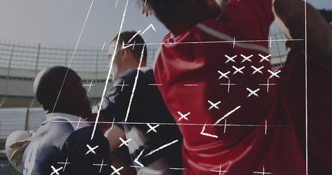 Rugby players executing strategy at stadium
