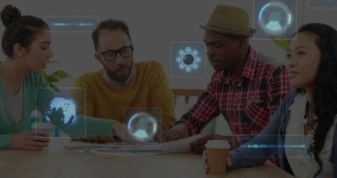 Diverse team collaborating over papers with augmented holographic data overlays in meeting