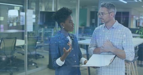 Diverse professionals collaborating thoughtfully in modern office