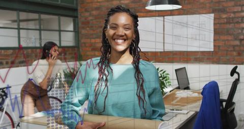Smiling Designer Holding Blueprint Tube in Industrial Office Space