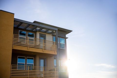 Modern Apartment Building with Sunlit Balconies