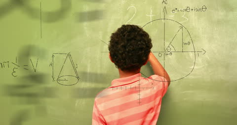 Child Enthusiastically Engages in Math Problem Solving on Blackboard