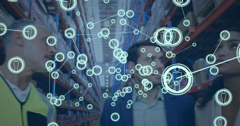 Warehouse team inspecting operations with augmented network overlay and logistics analytics