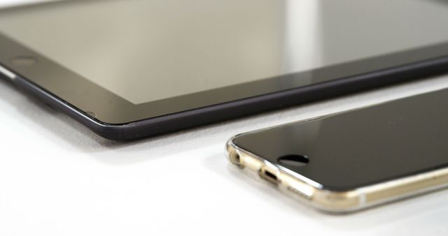 Close-up of Tablet and Smartphone on Desk with Modern Technology Focus - Download Free Stock Images Pikwizard.com