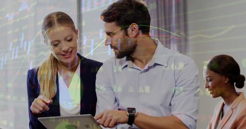 Team Collaborating with Financial Data Overlays in Modern Office