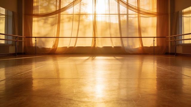 Sunlit ballet studio with flowing sheer curtains, polished hardwood floor and barre