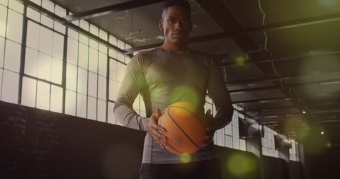 Basketball Player with Ball in Urban Gym Setting