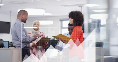 analyzing financial data in diverse modern office environment - Download Free Stock Images Pikwizard.com