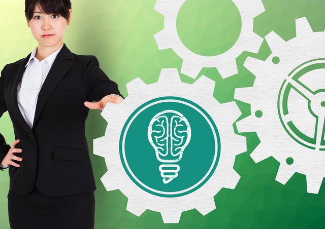Businesswoman Touching Cogwheel with Brain Icon, Concept of Innovation and Strategy - Download Free Stock Photos Pikwizard.com