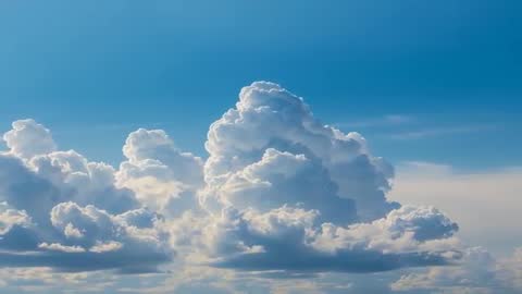 Dynamic Aerial View of Majestic Cumulus Clouds from Airplane Cabin