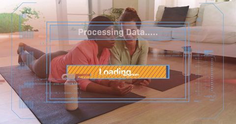 Women practicing yoga and checking fitness app on tablet with hud loading overlay