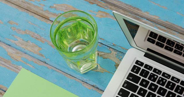 Refreshing Lemon Water Next to Laptop on Rustic Wooden Table - Download Free Stock Images Pikwizard.com