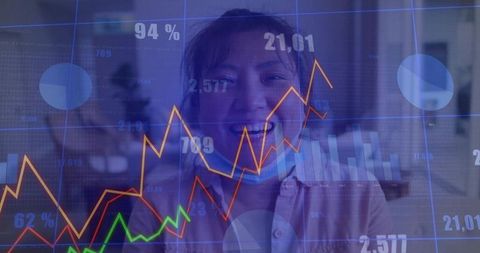 Asian Businessman Analyzing Financial Data with Overlay Charts
