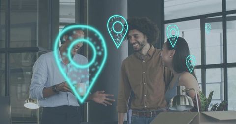 Coworkers using augmented reality location pins in modern office, collaborating and laughing