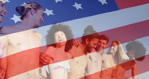 Happy friends at beach with american flag overlay