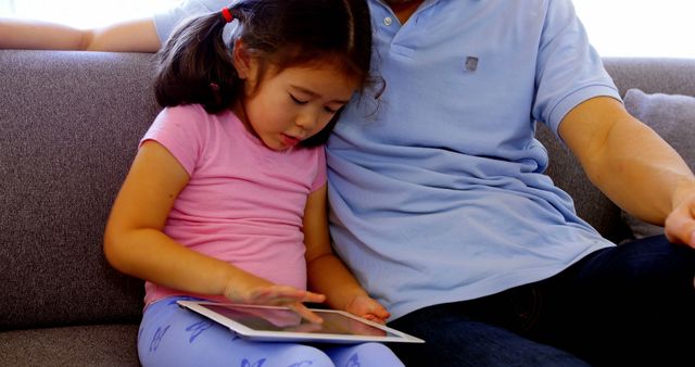 Father and Daughter Bonding Time with Digital Tablet on Couch - Download Free Stock Images Pikwizard.com