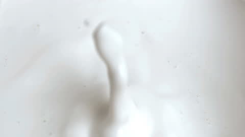 Raspberry Falling into Creamy Sauce Slow Motion