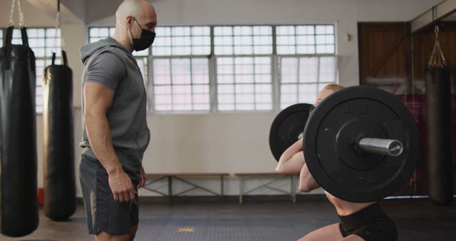 Personal Trainer Coaching Female Athlete Weightlifting in Gym - Download Free Stock Images Pikwizard.com