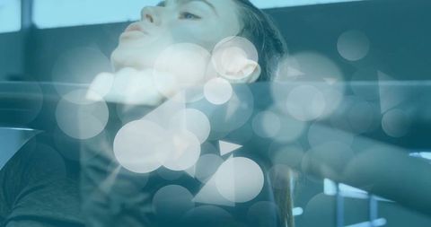 Woman stretching neck on gym bar with digital effects