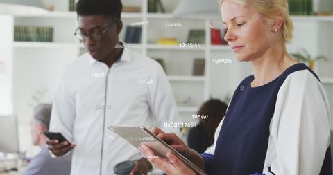 Business Professionals Using Technology with Digital Data Overlay