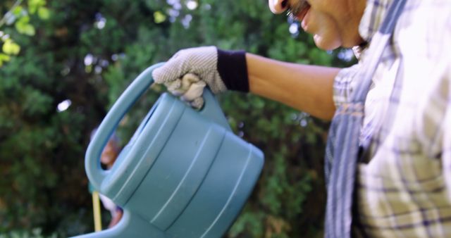 Senior Man Watering Plants in Garden with Watering Can - Download Free Stock Images Pikwizard.com