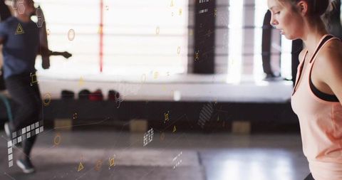 Athletic Woman Jumping Rope in Gym with Digital Graphics