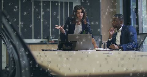 Diverse Professionals Analyzing Digital Data in Office Space