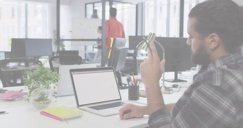 Man Working in Modern Open Office, Team Collaborating