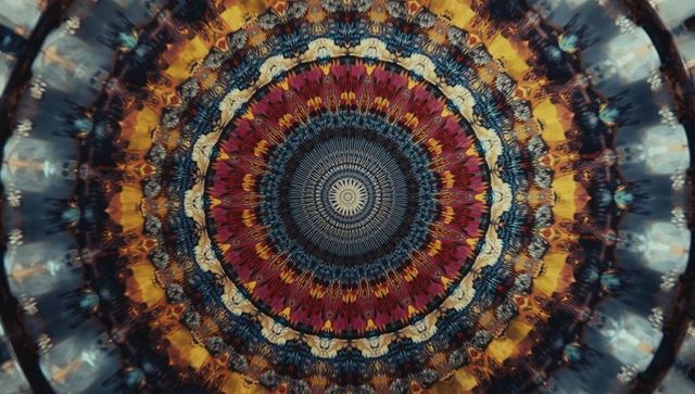 Vibrant mandala kaleidoscope in red, yellow, and blue
